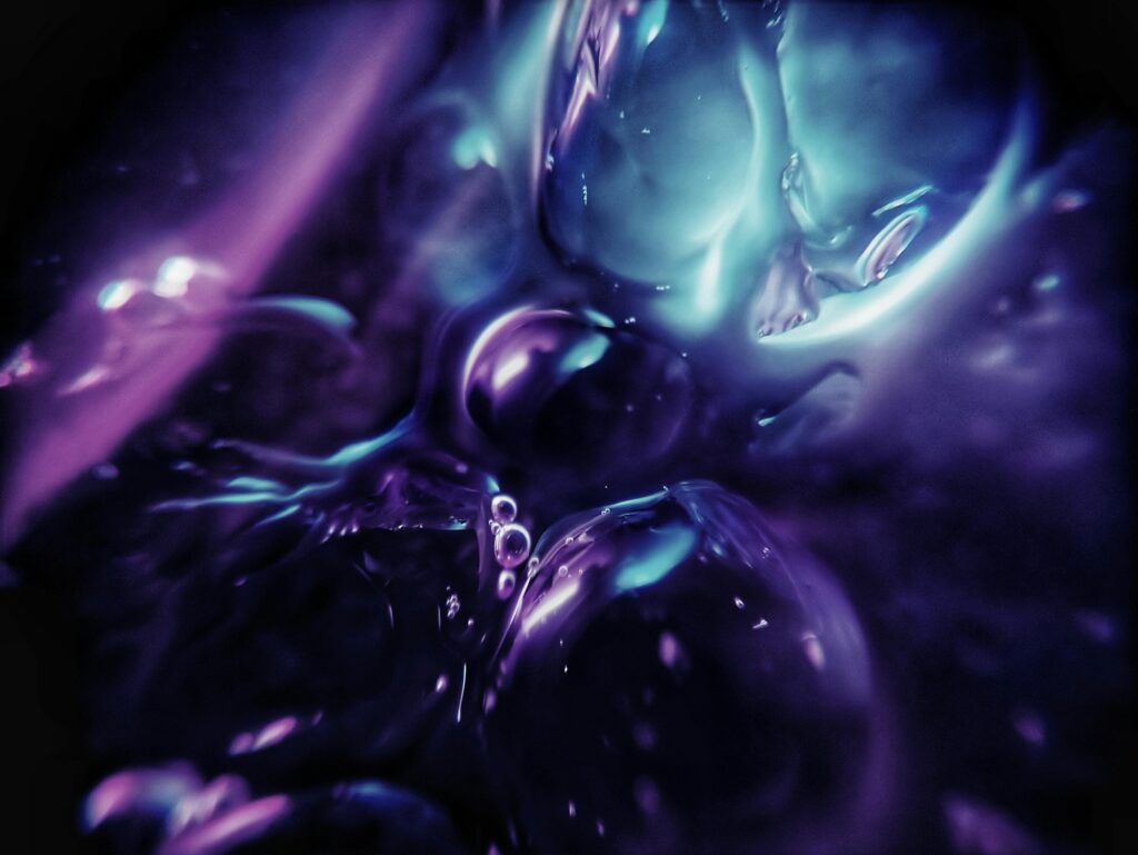 A vivid abstract image with flowing purple and blue hues creating a mesmerizing effect.